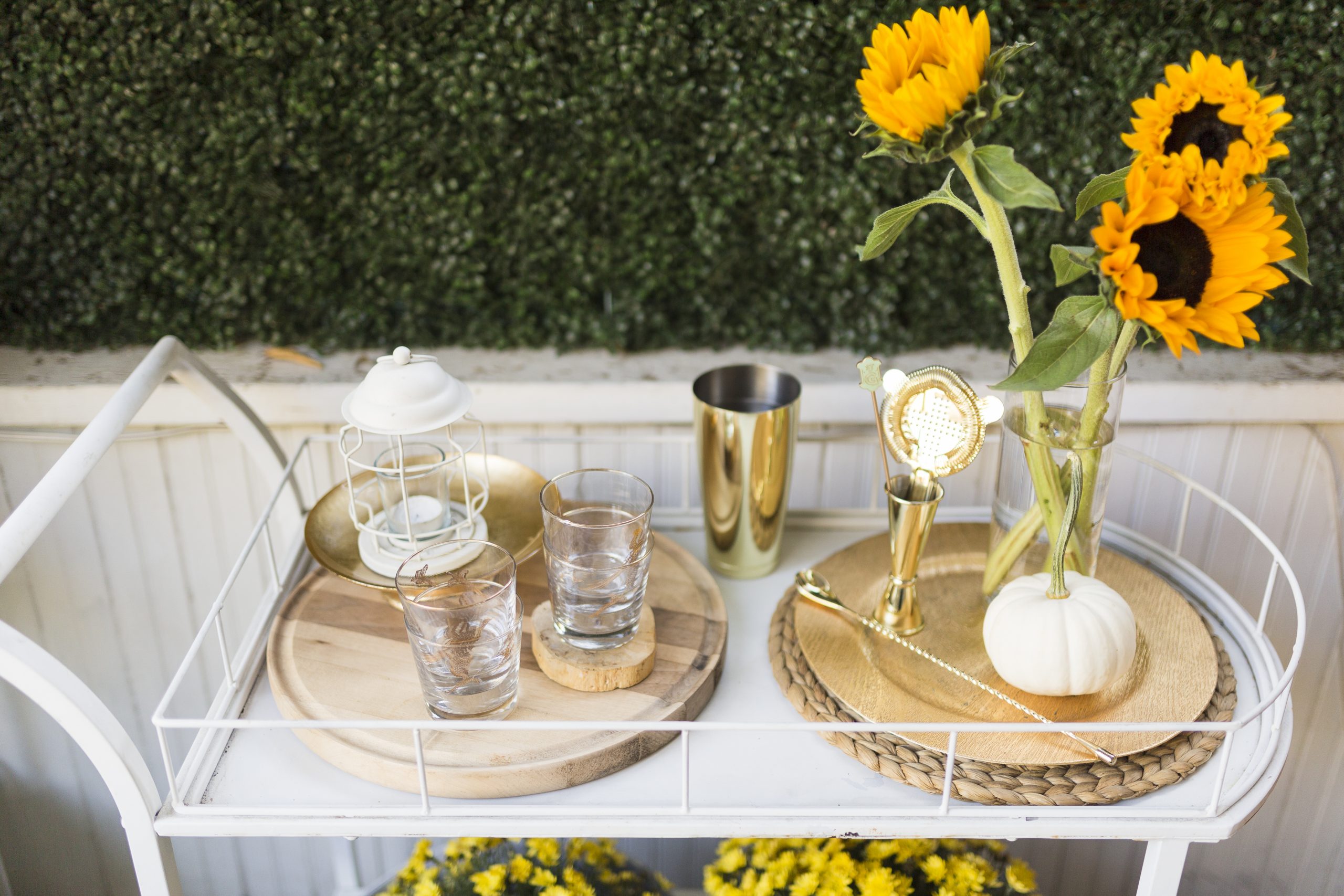 gold cocktail set on vintage bar cart